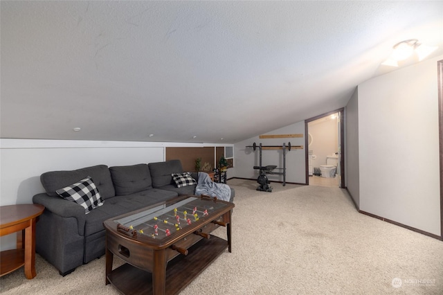 living room featuring a textured ceiling, light carpet, and vaulted ceiling