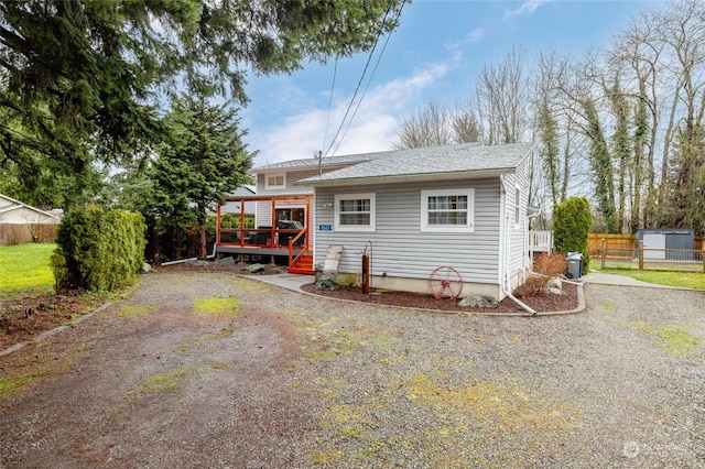 bungalow-style house featuring a wooden deck