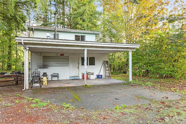 view of outbuilding featuring a carport