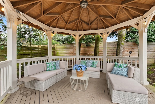 deck with an outdoor living space and a gazebo