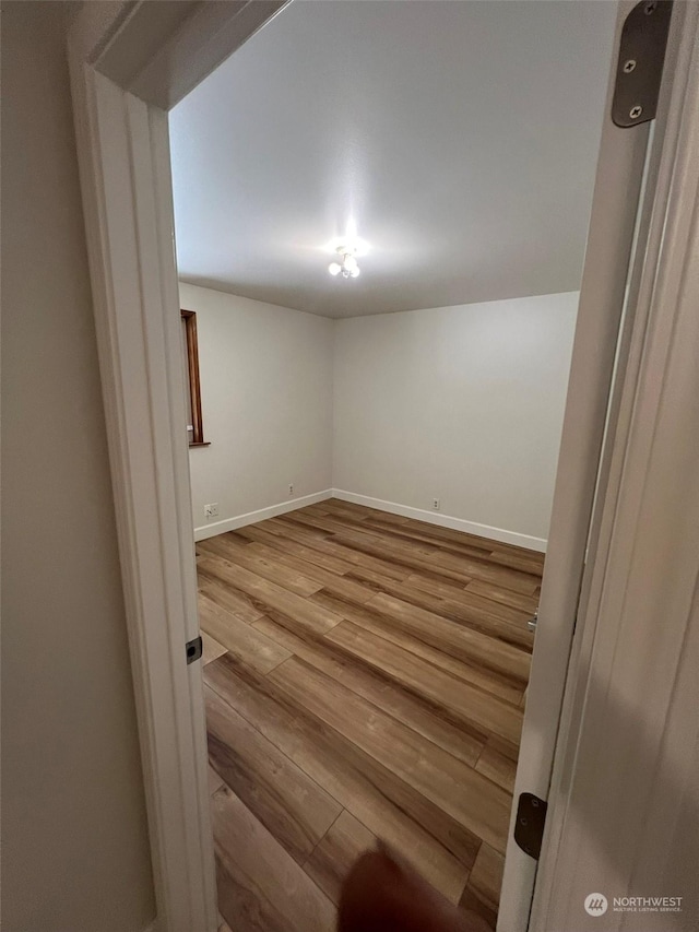 empty room featuring hardwood / wood-style flooring