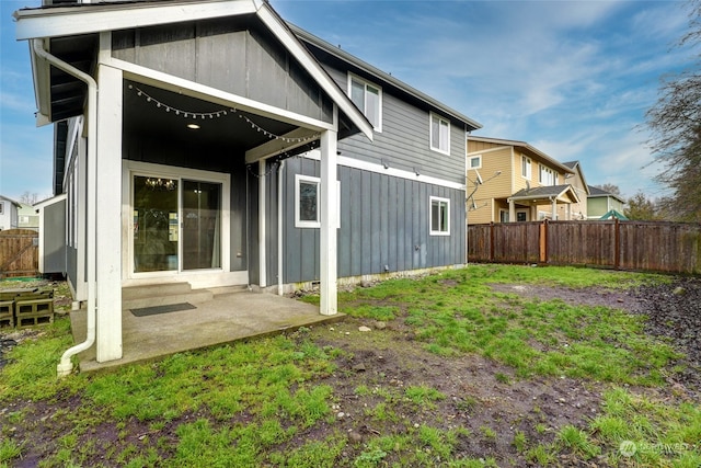 rear view of property featuring a patio area