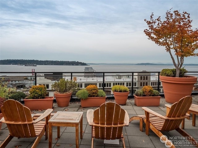 balcony featuring a water view