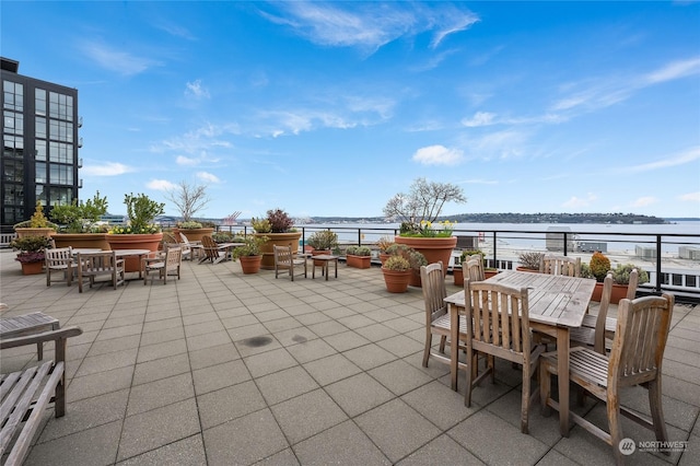 view of patio featuring a water view