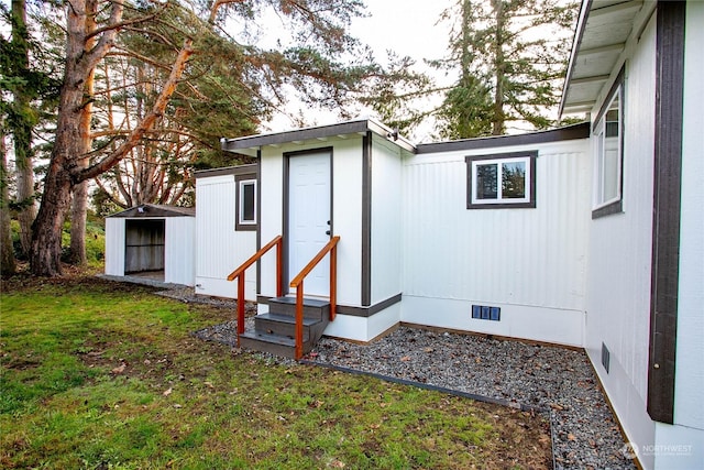 view of outbuilding featuring a yard