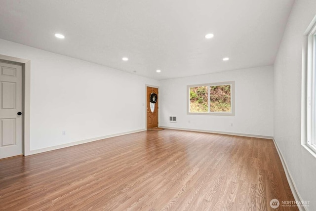 spare room with visible vents, baseboards, light wood-style flooring, and recessed lighting