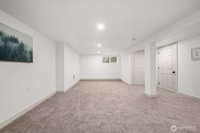 below grade area featuring carpet floors, recessed lighting, and baseboards