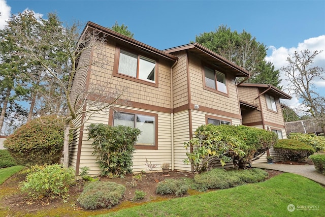 view of home's exterior with a yard