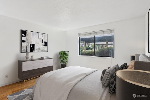 bedroom featuring hardwood / wood-style floors