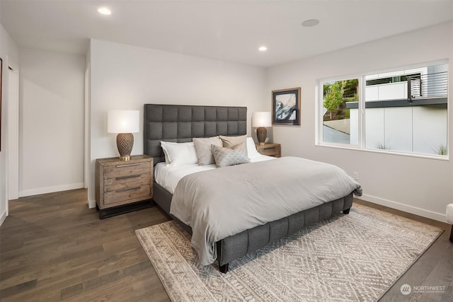 bedroom with dark wood-type flooring