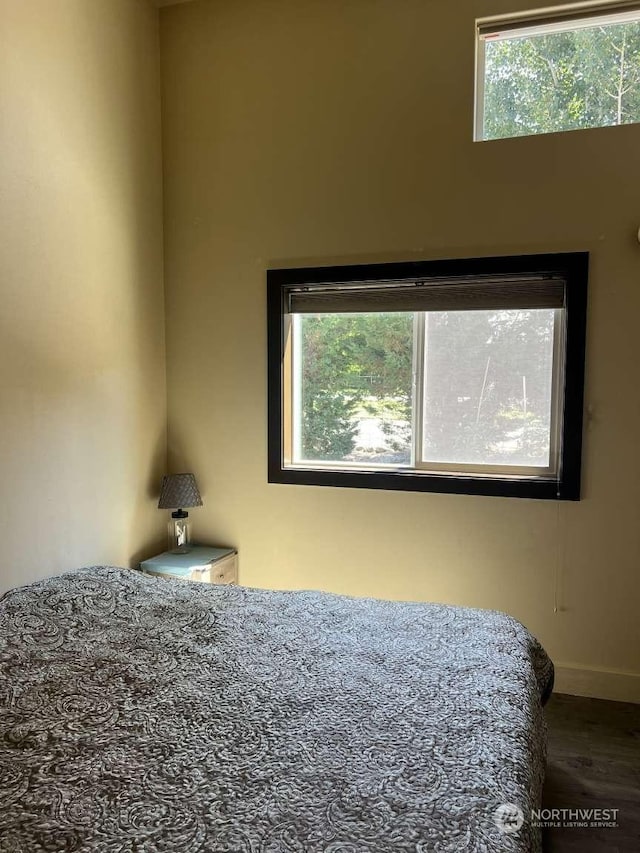 bedroom with wood-type flooring