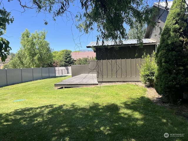 view of yard with a wooden deck