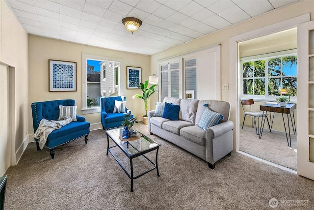 living room featuring baseboards and carpet flooring