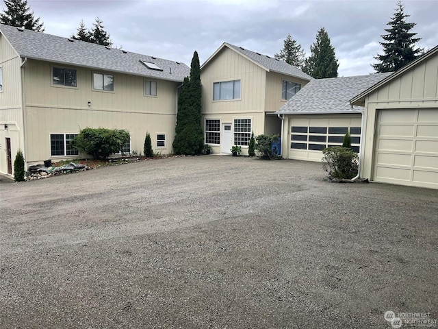 front facade with a garage