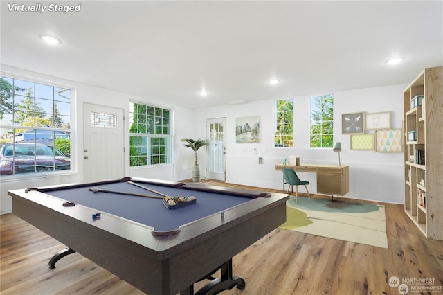 game room with light hardwood / wood-style floors and pool table