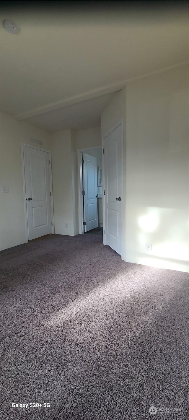 view of carpeted spare room