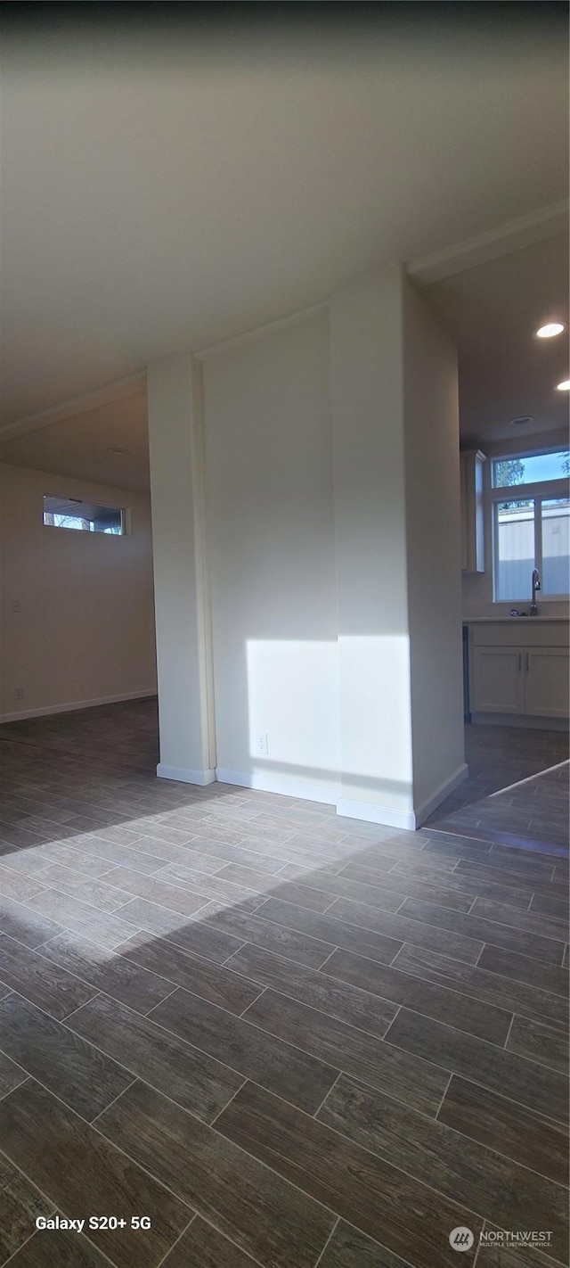 unfurnished room featuring sink