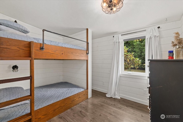 bedroom with hardwood / wood-style flooring