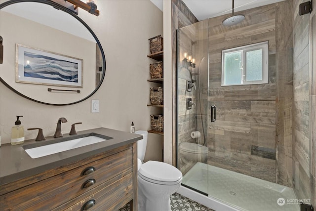 bathroom featuring toilet, a shower with shower door, and vanity