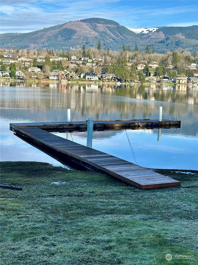 view of dock featuring a water and mountain view