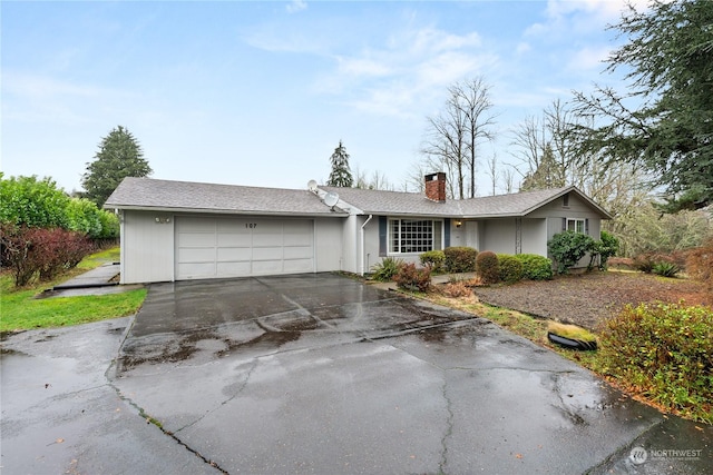 single story home featuring a garage