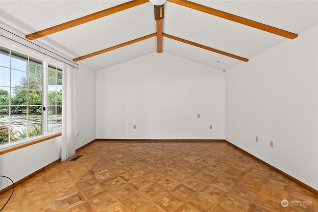 unfurnished living room featuring vaulted ceiling with beams, parquet floors, and a textured ceiling