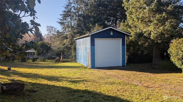 garage featuring a lawn