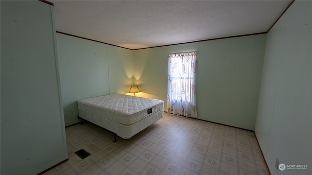 bedroom with a textured ceiling