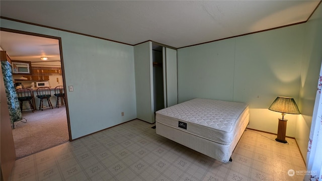 carpeted bedroom with crown molding