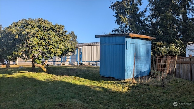 view of outbuilding with a yard