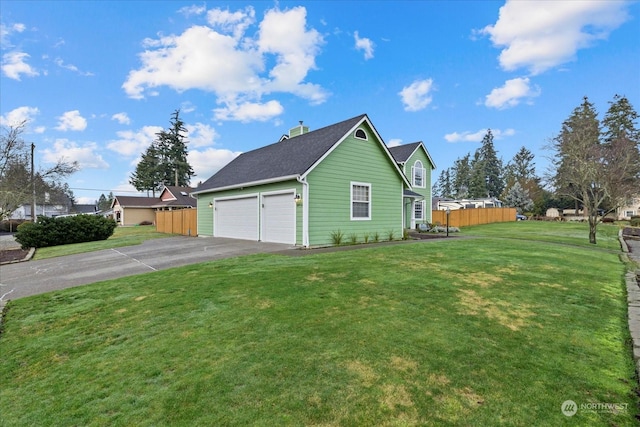 view of side of home with a yard