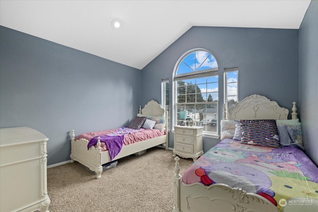 carpeted bedroom featuring lofted ceiling