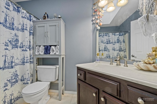 bathroom featuring tile patterned floors, vanity, a shower with shower curtain, and toilet