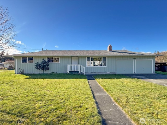 single story home with a garage, driveway, a chimney, and a front yard