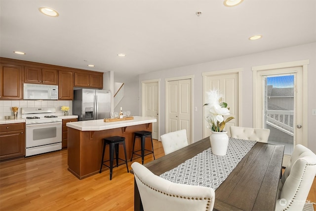 dining space featuring light hardwood / wood-style floors