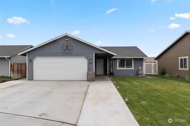 ranch-style house with a front yard and a garage