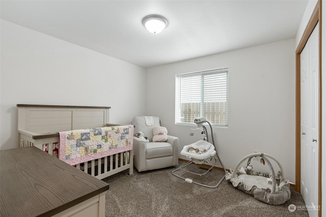 carpeted bedroom with a nursery area and a closet