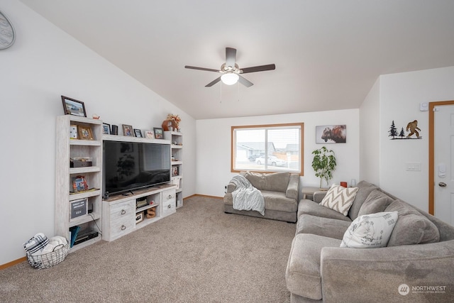 living room with ceiling fan, vaulted ceiling, and carpet