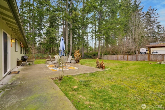 view of yard with a fenced backyard and a patio