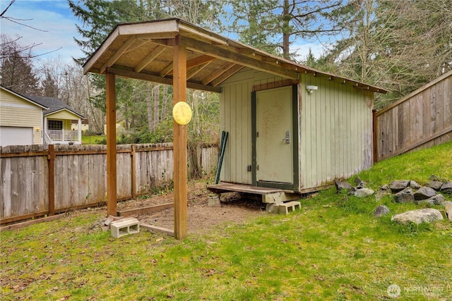 view of shed featuring a fenced backyard