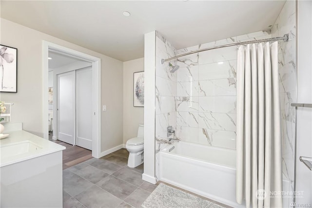 full bathroom featuring vanity, shower / bath combination with curtain, and toilet