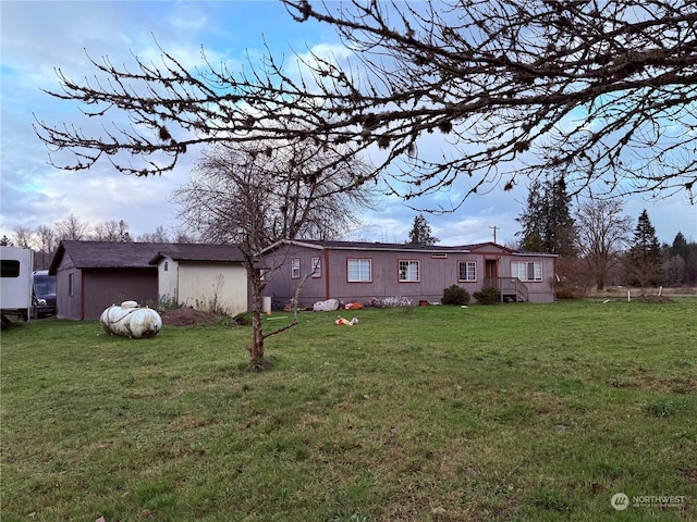 rear view of house with a lawn