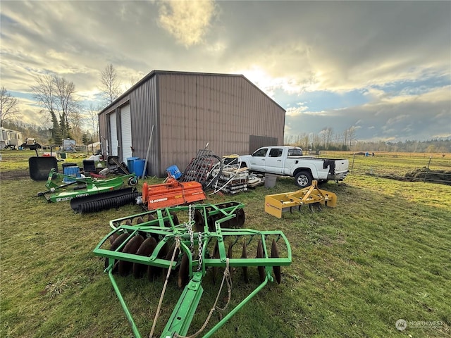 view of outbuilding with a yard