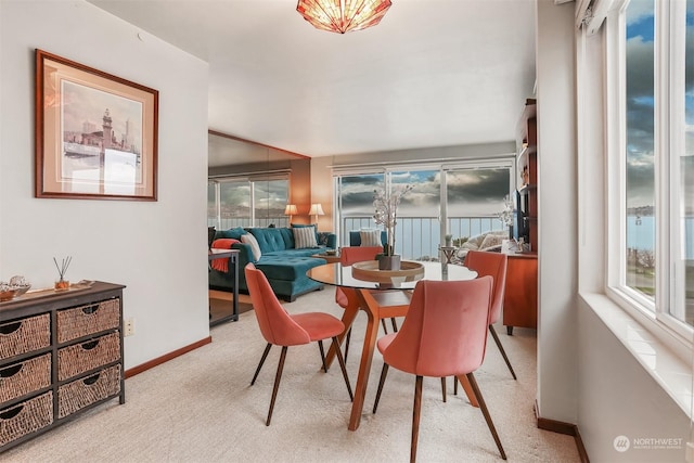 dining room with light carpet