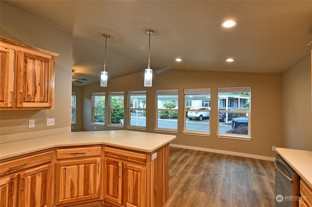 kitchen with kitchen peninsula, dark hardwood / wood-style flooring, stainless steel dishwasher, ceiling fan, and lofted ceiling