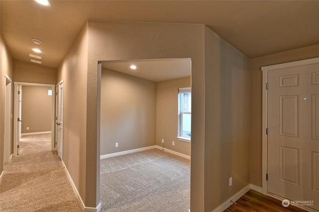 foyer entrance with carpet flooring