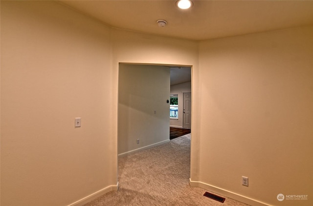 hallway featuring carpet floors