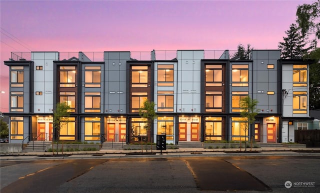 view of outdoor building at dusk