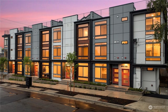 view of outdoor building at dusk