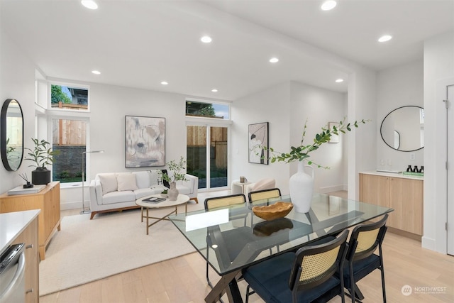 dining space with light wood-type flooring